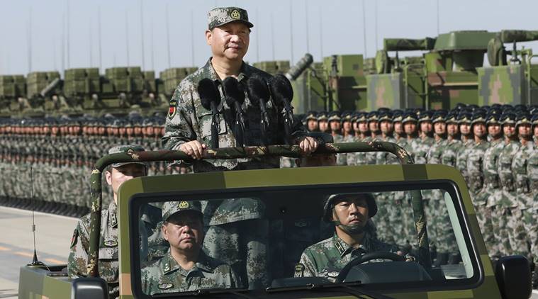 President Xi Jinping wearing military dressed on a military car last day inspected 12,000 soldiers' parade