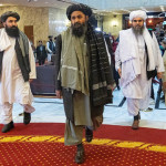 Taliban co-founder Mullah Abdul Ghani Baradar (C) and other members of the Taliban arrive to attend an international conference in Moscow
