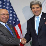 John Kerry and Foreign Minister Sartaj shake hands Advisor